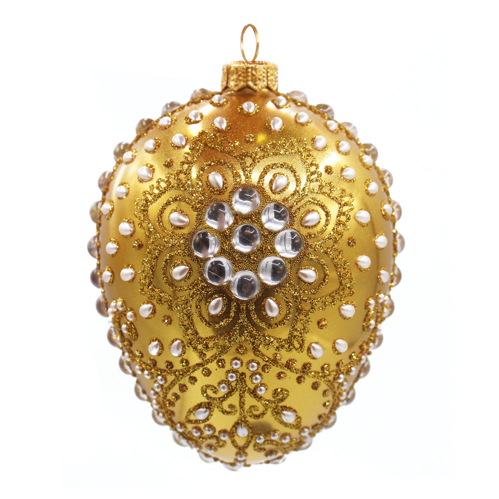 Œuf en verre soufflé doré et blanc orné de perles et motifs pailletés