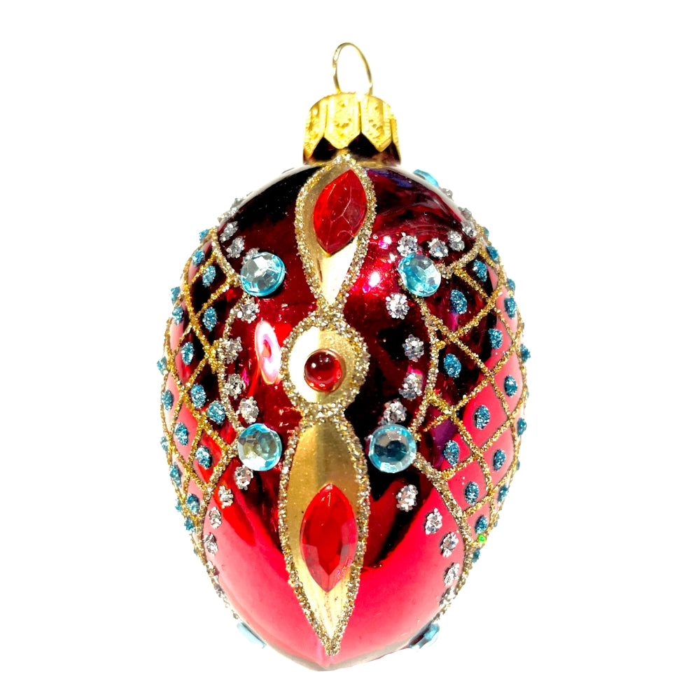 Œuf en verre soufflé rouge et doré orné de strass bleus et motifs filigranés