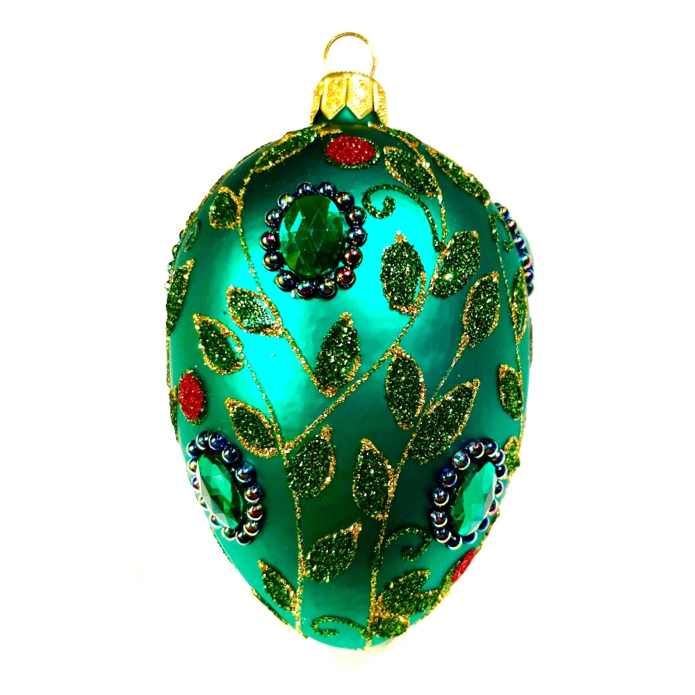 Oeuf en verre soufflé vert décoré de feuilles pailletées, strass et perles