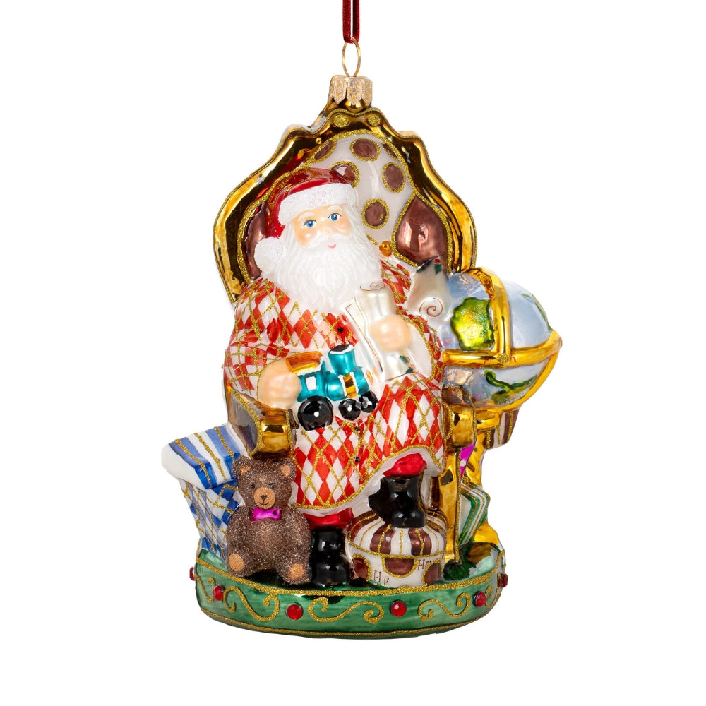Père Noël en verre soufflé assis sur un trône doré avec jouets et ours en peluche
