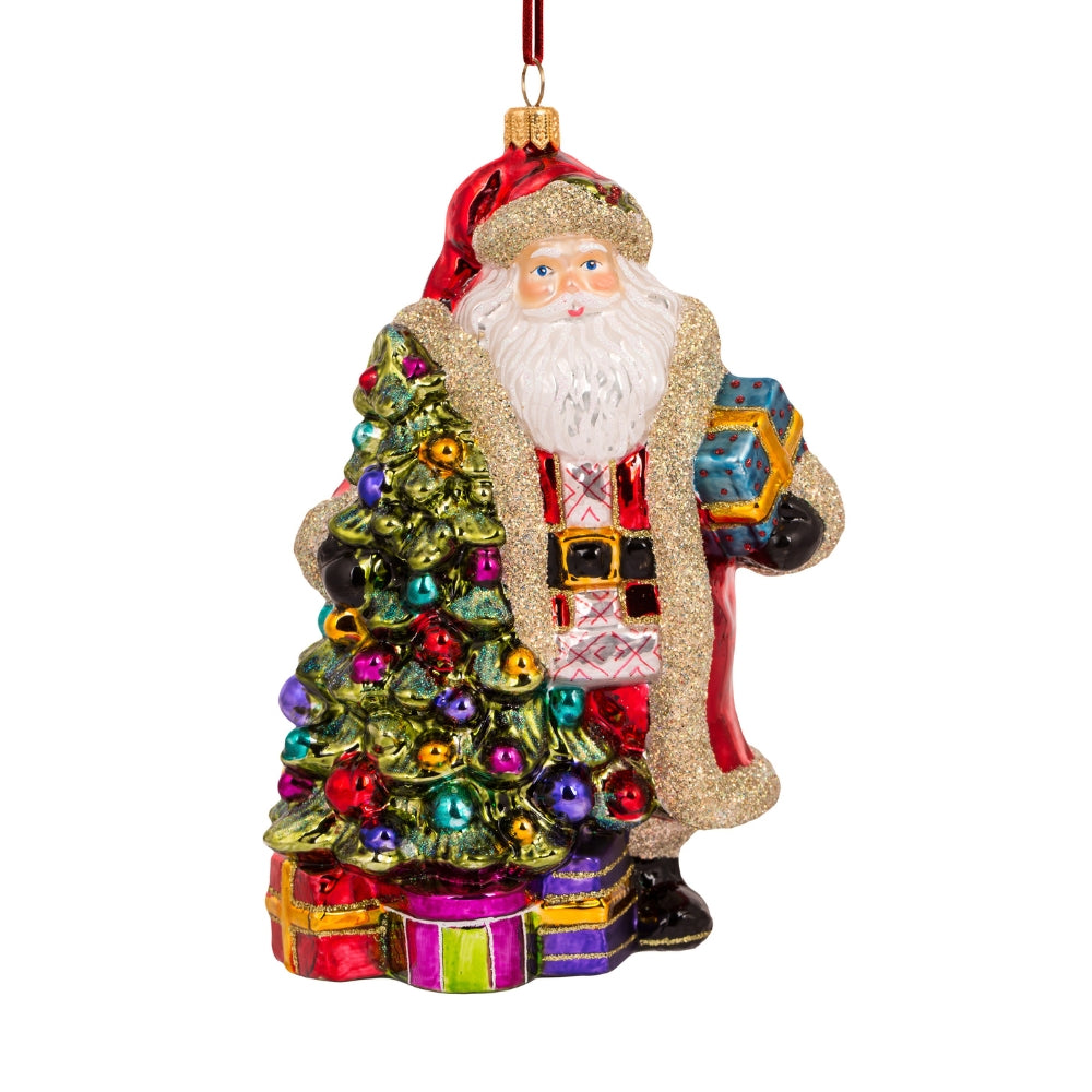 Père Noël en verre soufflé tenant des cadeaux, sapin pailleté décoré de boules multicolores