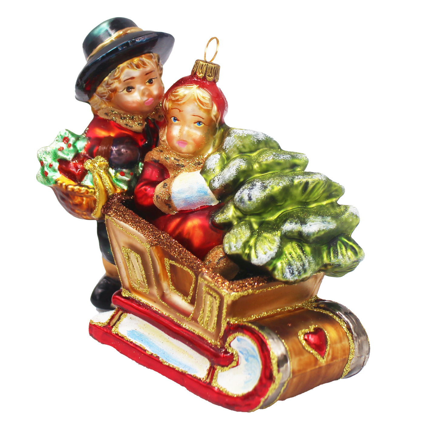 Enfants sur une luge en verre soufflé, décor de Noël peint à la main en rouge, or et vert