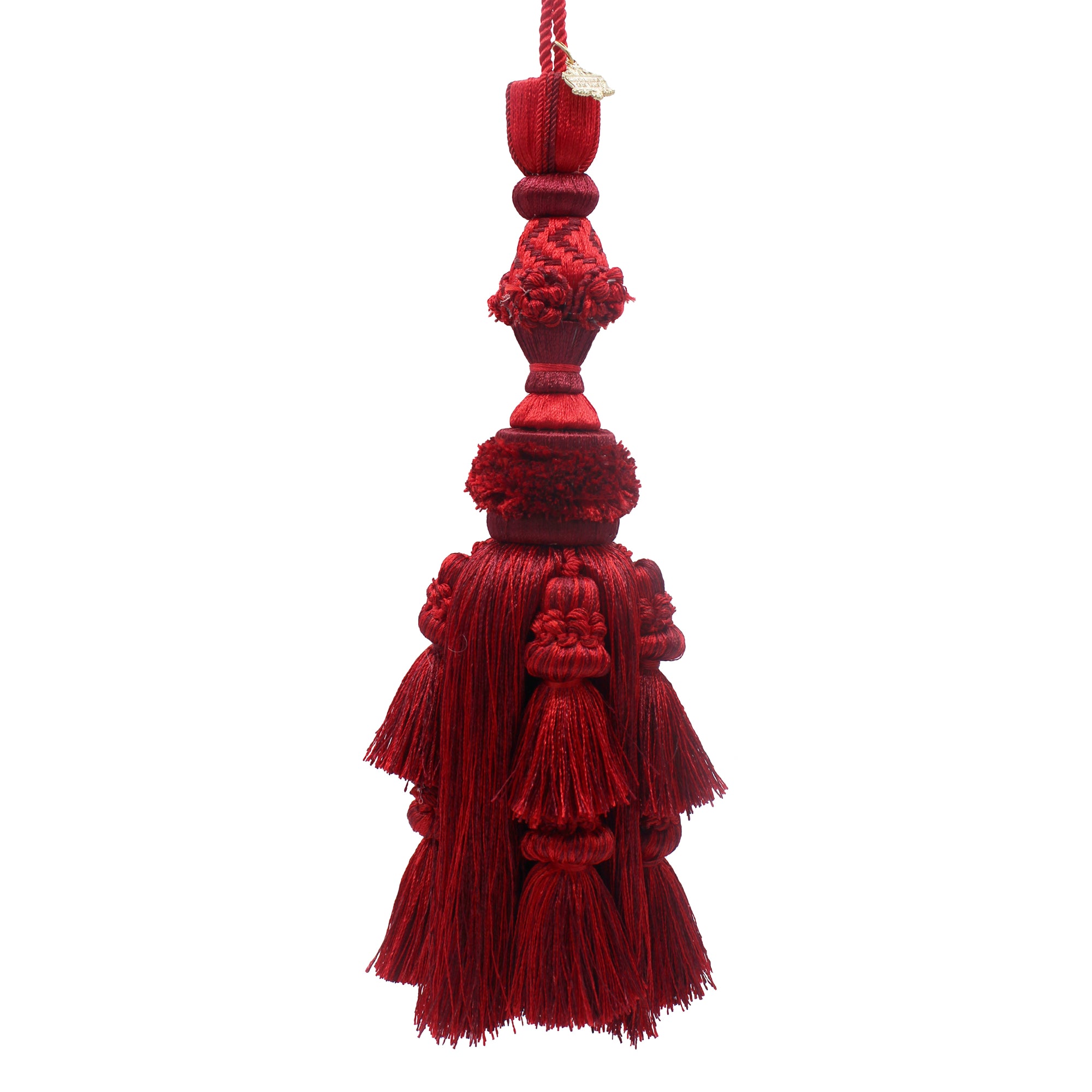 Pompon décoratif rouge et bordeaux en coton avec écusson doré, à suspendre