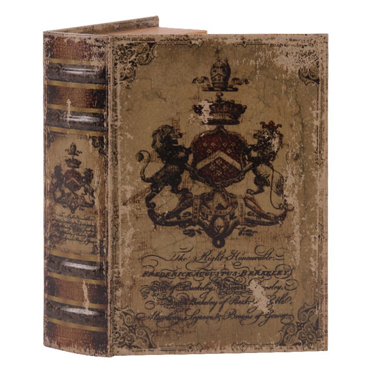 Boîte-livre brune en carton, couvercle décoré d'armoiries et tranches façon livre ancien