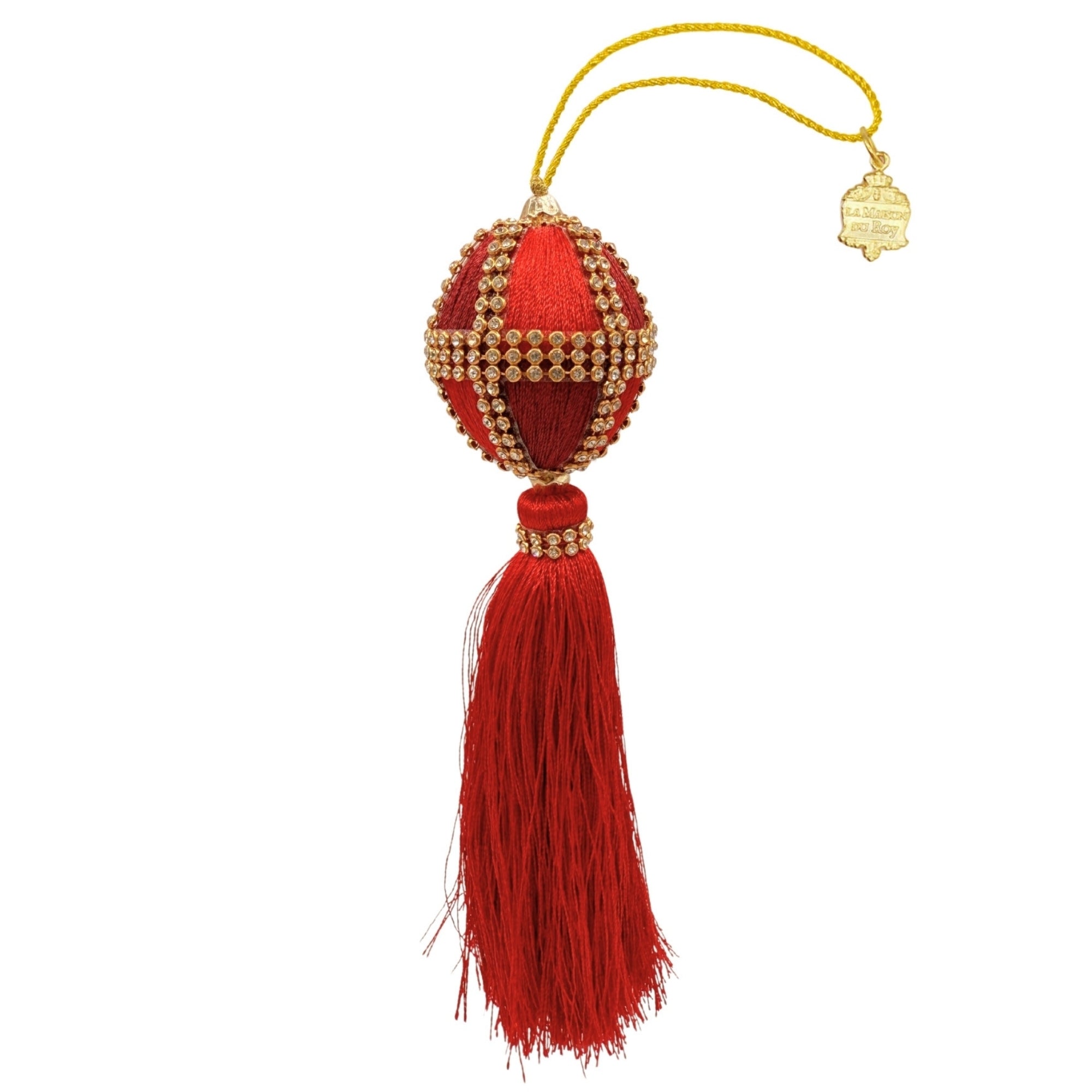 Boule de Noël rouge strassée en velours avec croisillons dorés et long pompon de fils rouges