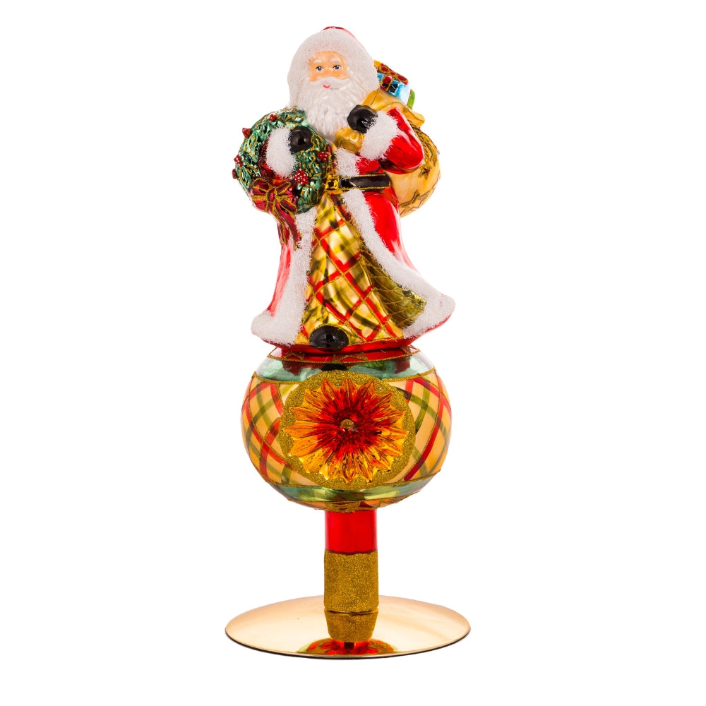 Cimier de sapin en verre soufflé Père Noël avec sac de cadeaux et base décorée