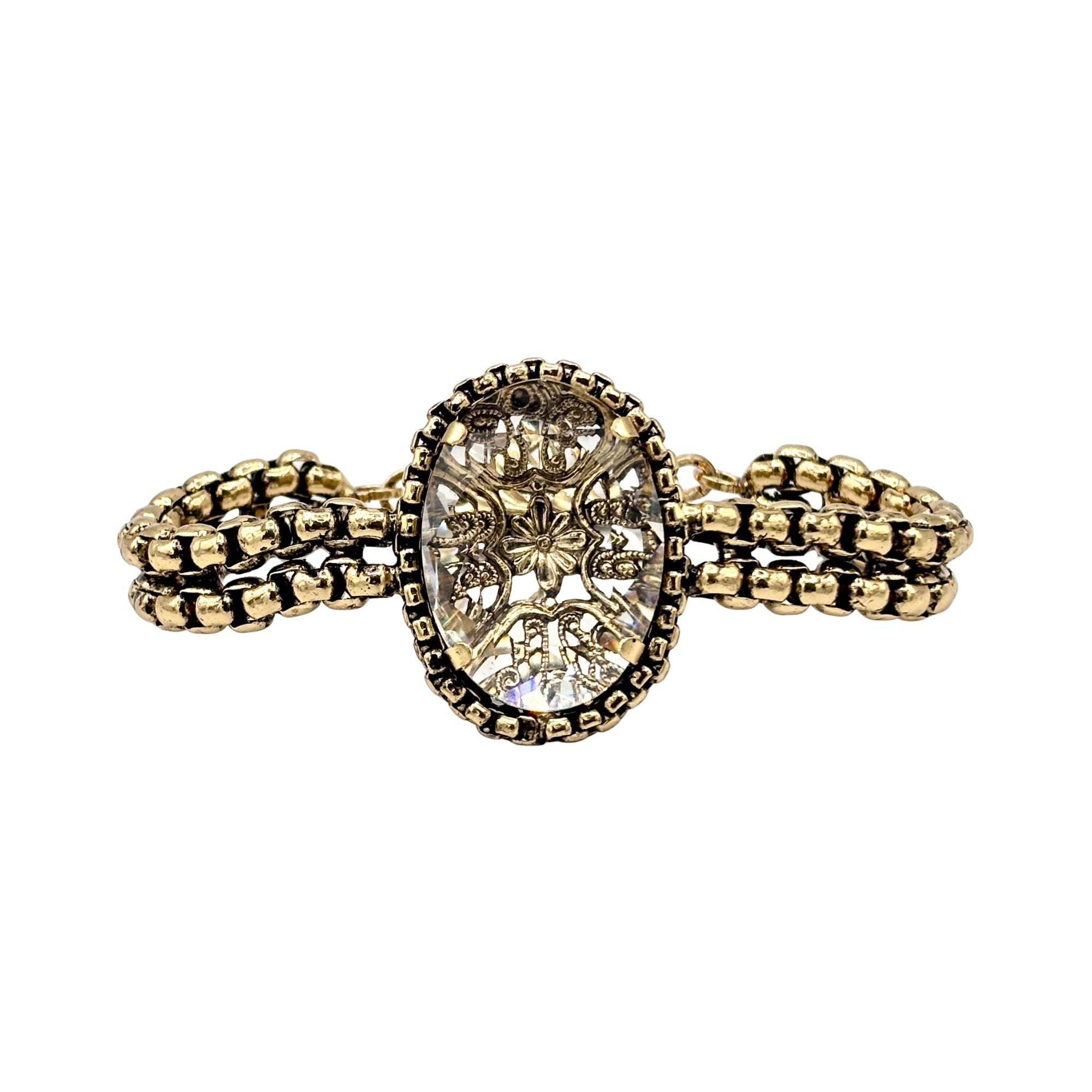 Bracelet en cristal ovale facetté, monture dorée ajourée motif floral et double chaîne maillons texturés