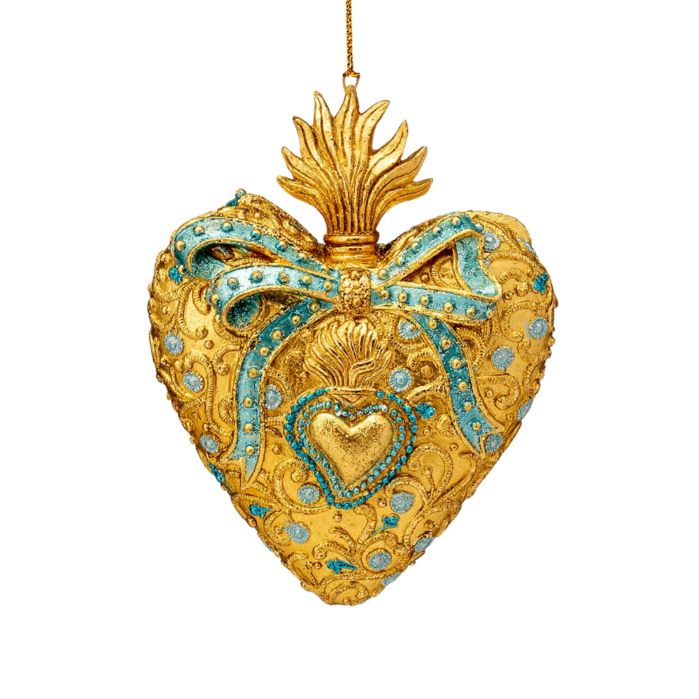 Ex-voto cœur doré suspendu, décoré d’un nœud et de détails bleu clair