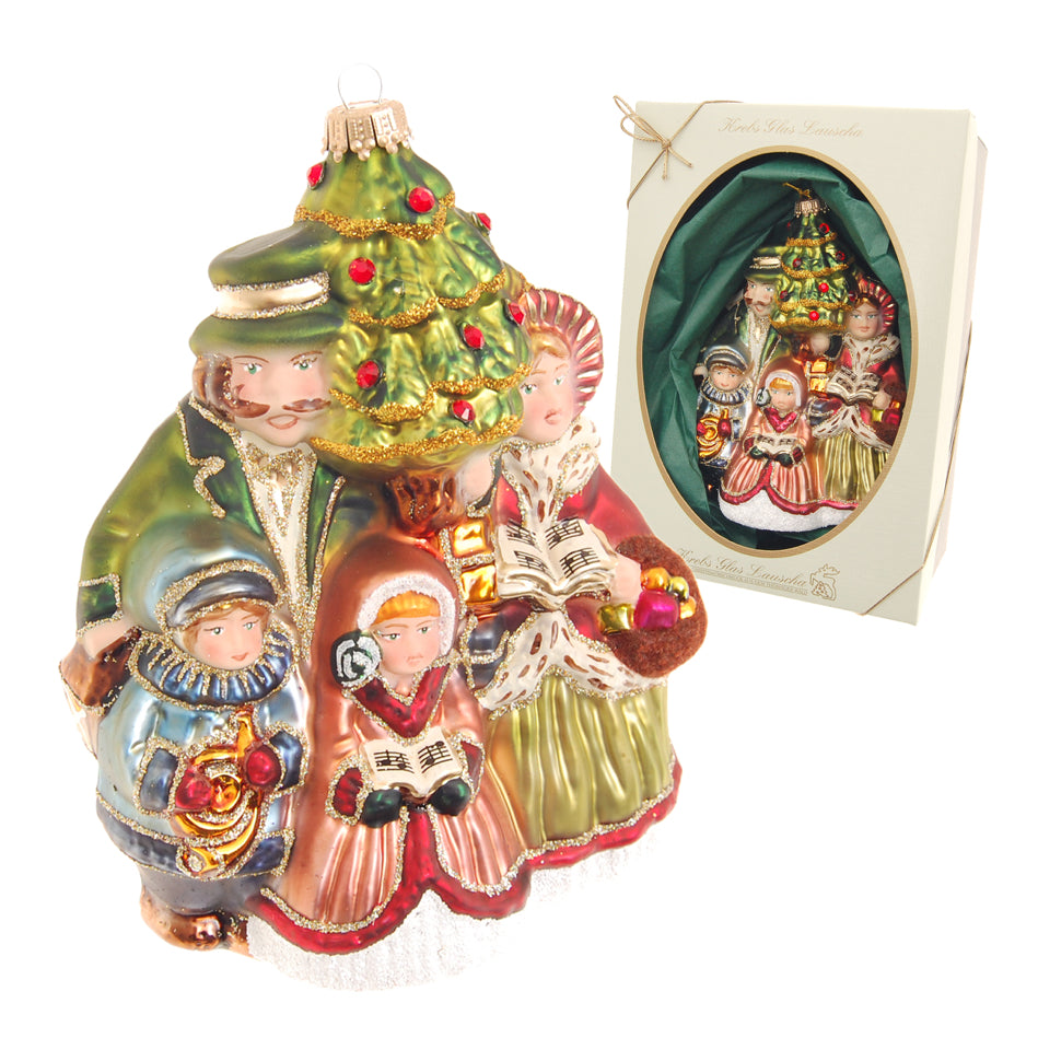 Décoration de Noël en verre soufflé représentant une famille autour d un sapin vert et doré