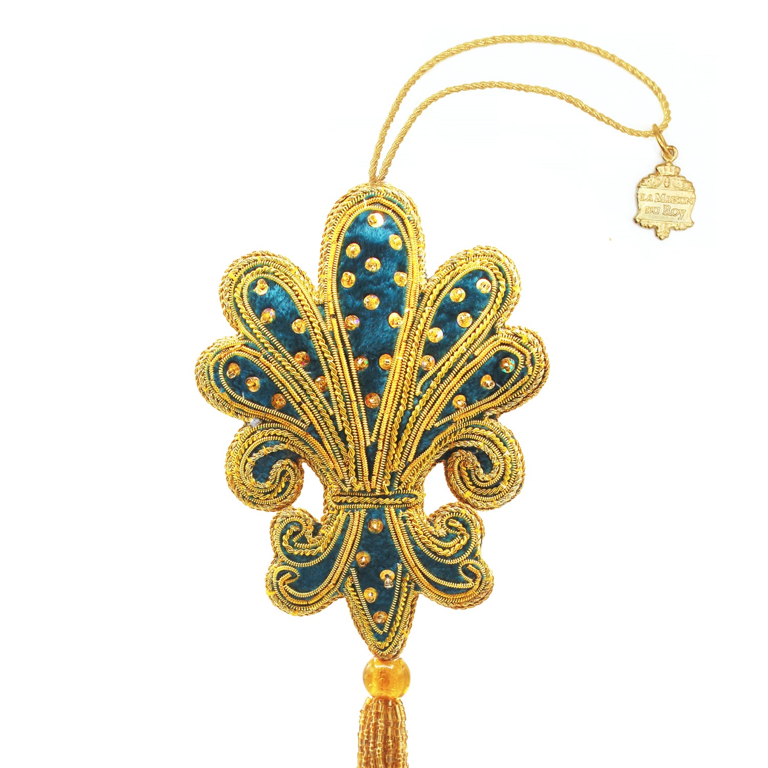 Fleur de lys en velours bleu brodée de fils dorés et perles, avec pompon
