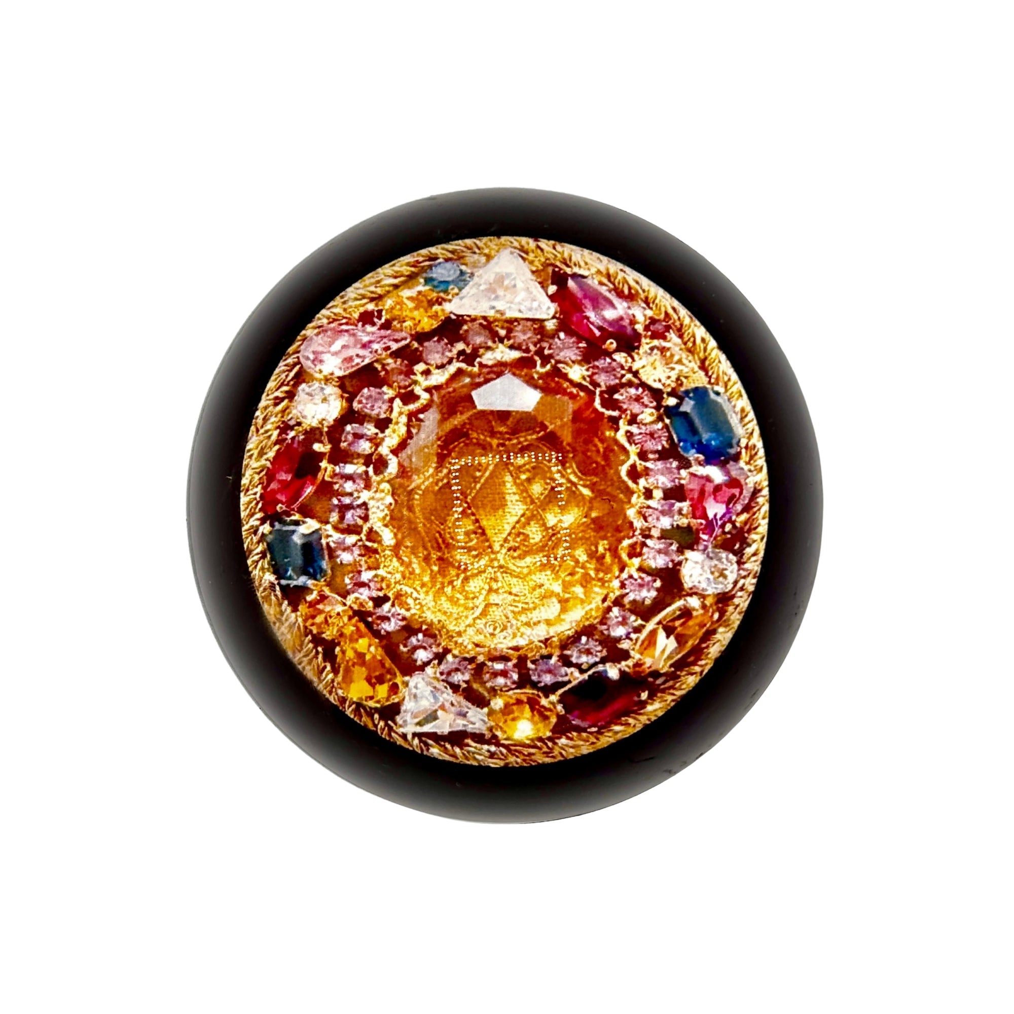 Grande hémimorphose ronde avec centre doré gravé, entourée de pierres multicolores et bord noir brillant