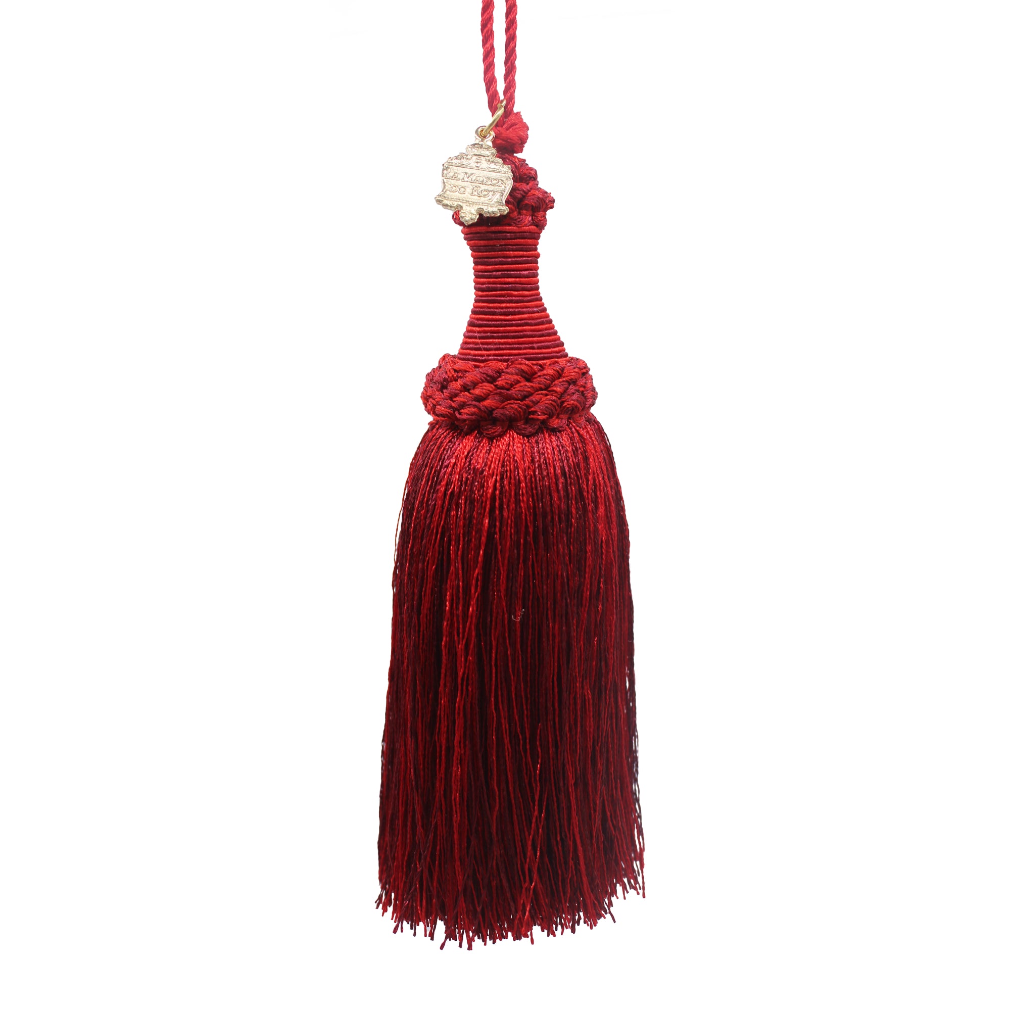 Pompon décoratif en coton rouge et bordeaux avec écusson doré