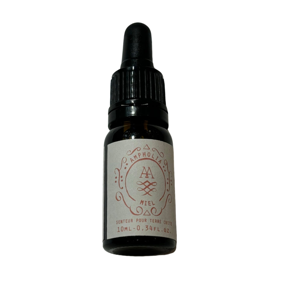 Flacon compte-gouttes noir d’extrait de parfum miel 10 ml, étiquette beige