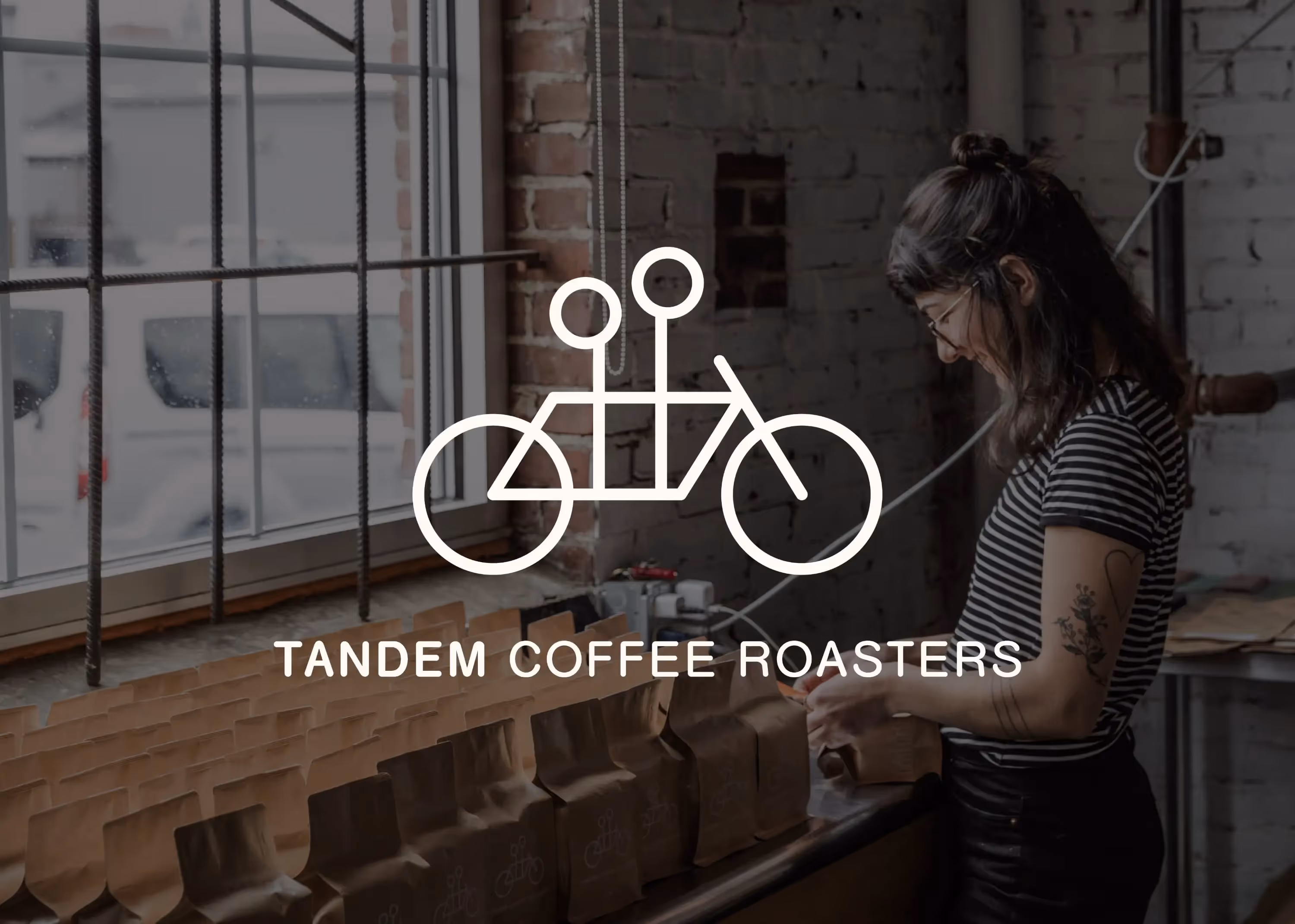 A woman standing in front of a window