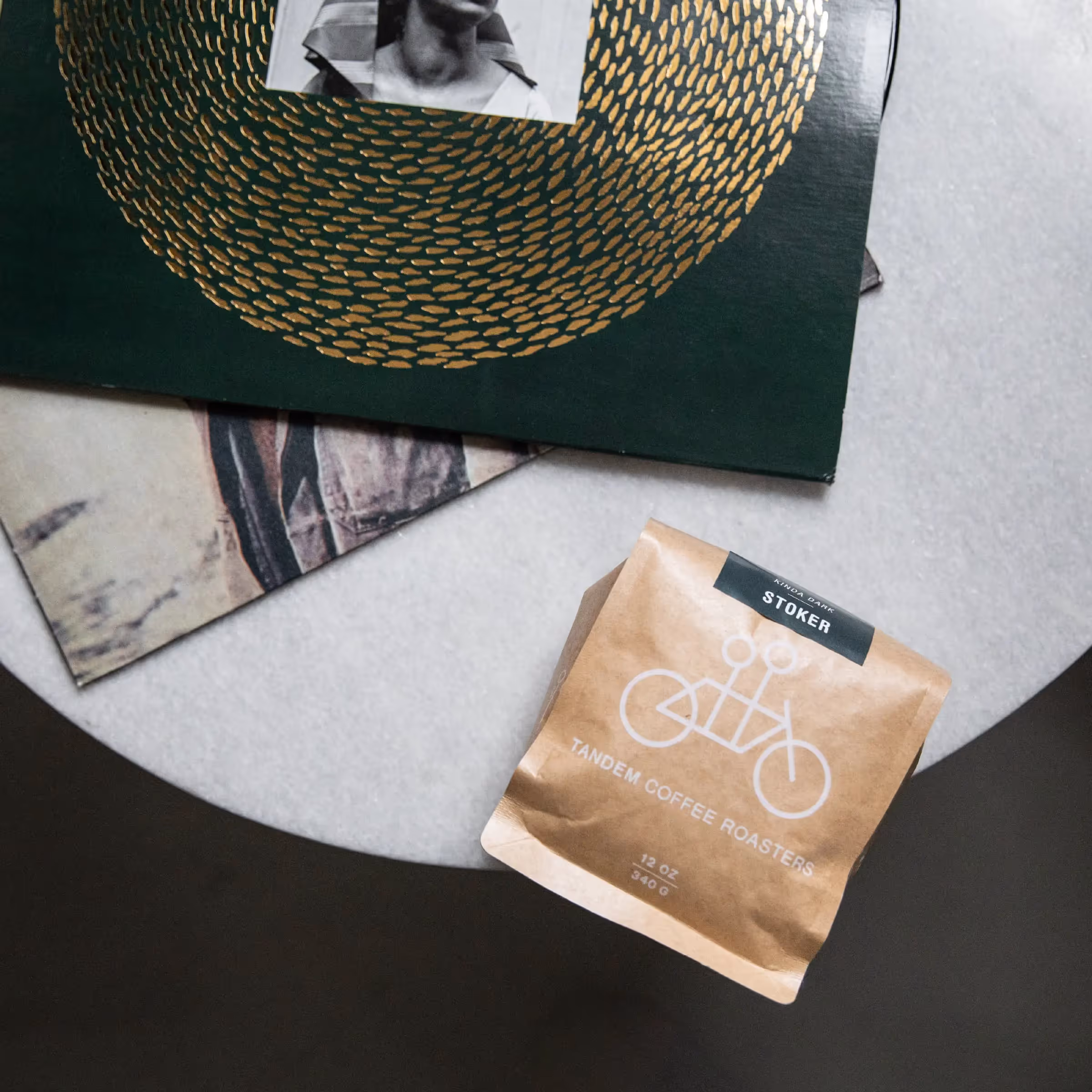 Tandem Coffee Roasters bag with artistic green and gold circular design