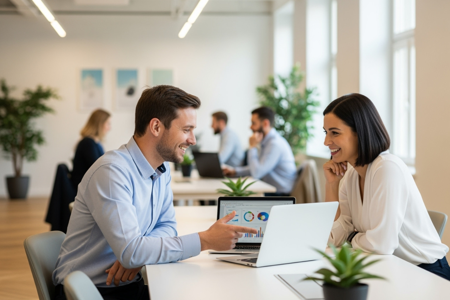 two people having a positive, collaborative meeting in a modern office setting - shopify expert maine