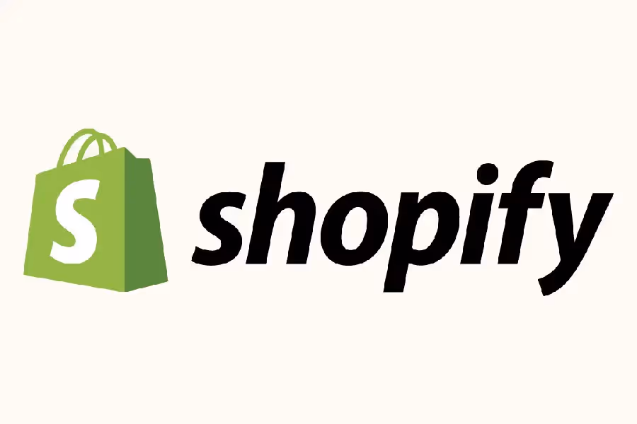 A green shopping bag icon with the word shopify next to it