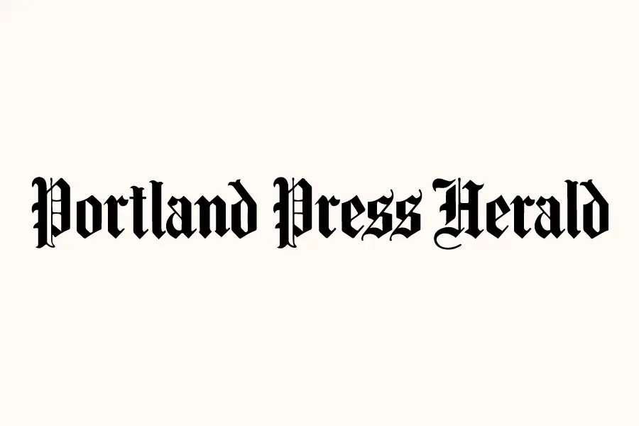 Portland Press Herald logo in ornate black gothic style lettering on cream background