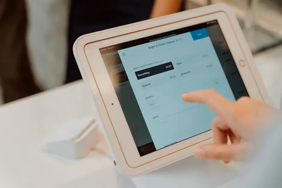 A person using a tablet on a table