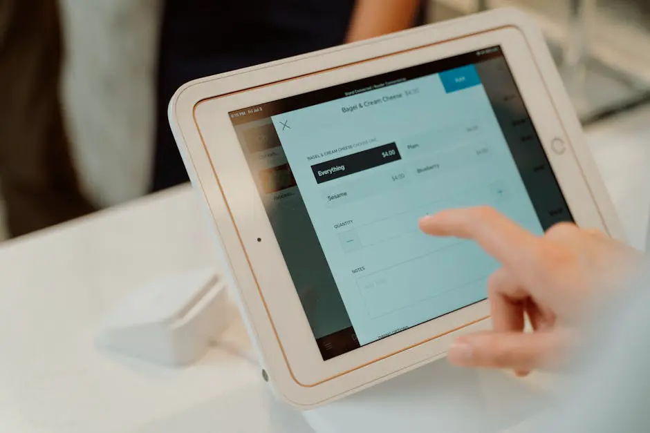 A person using a tablet on a table
