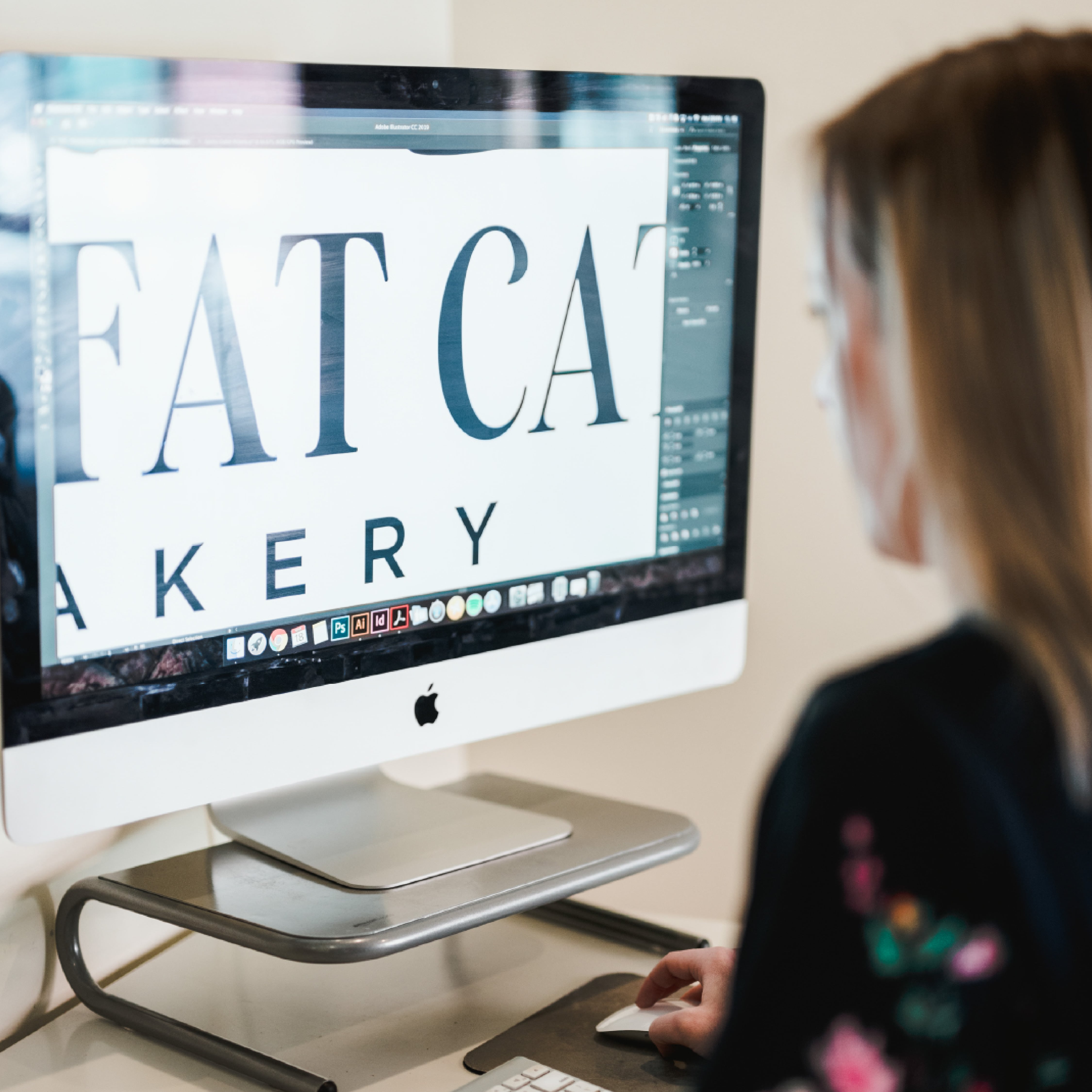 Two Fat Cats Bakery printed menu and kraft-paper business cards in the refreshed brand style