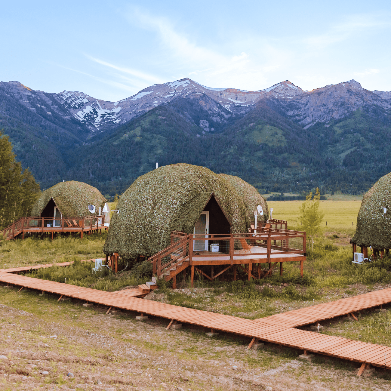 Geodesic domes in front of Grand Teton Mountains in the winter.