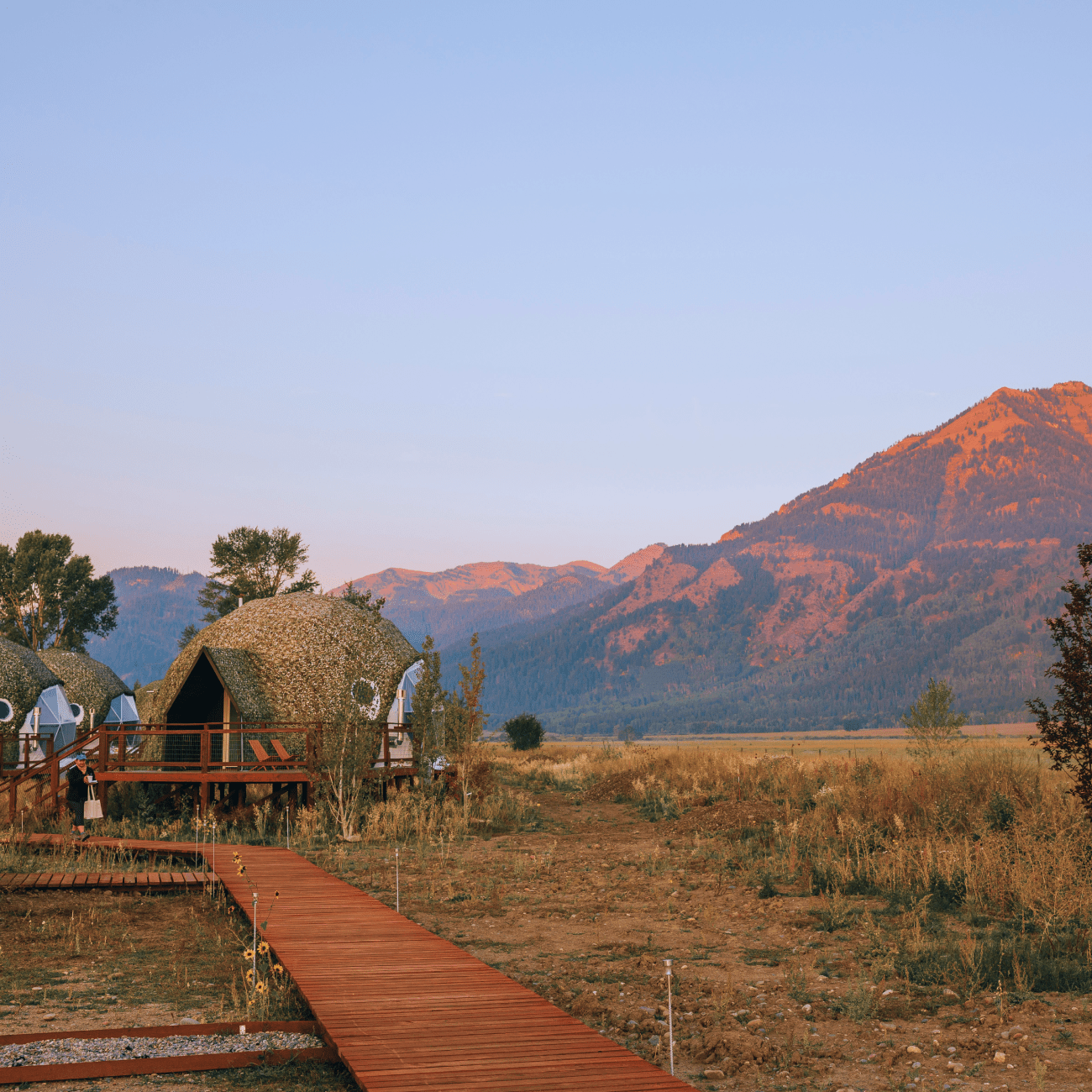 Geodesic dome in front of Teton Mountains.