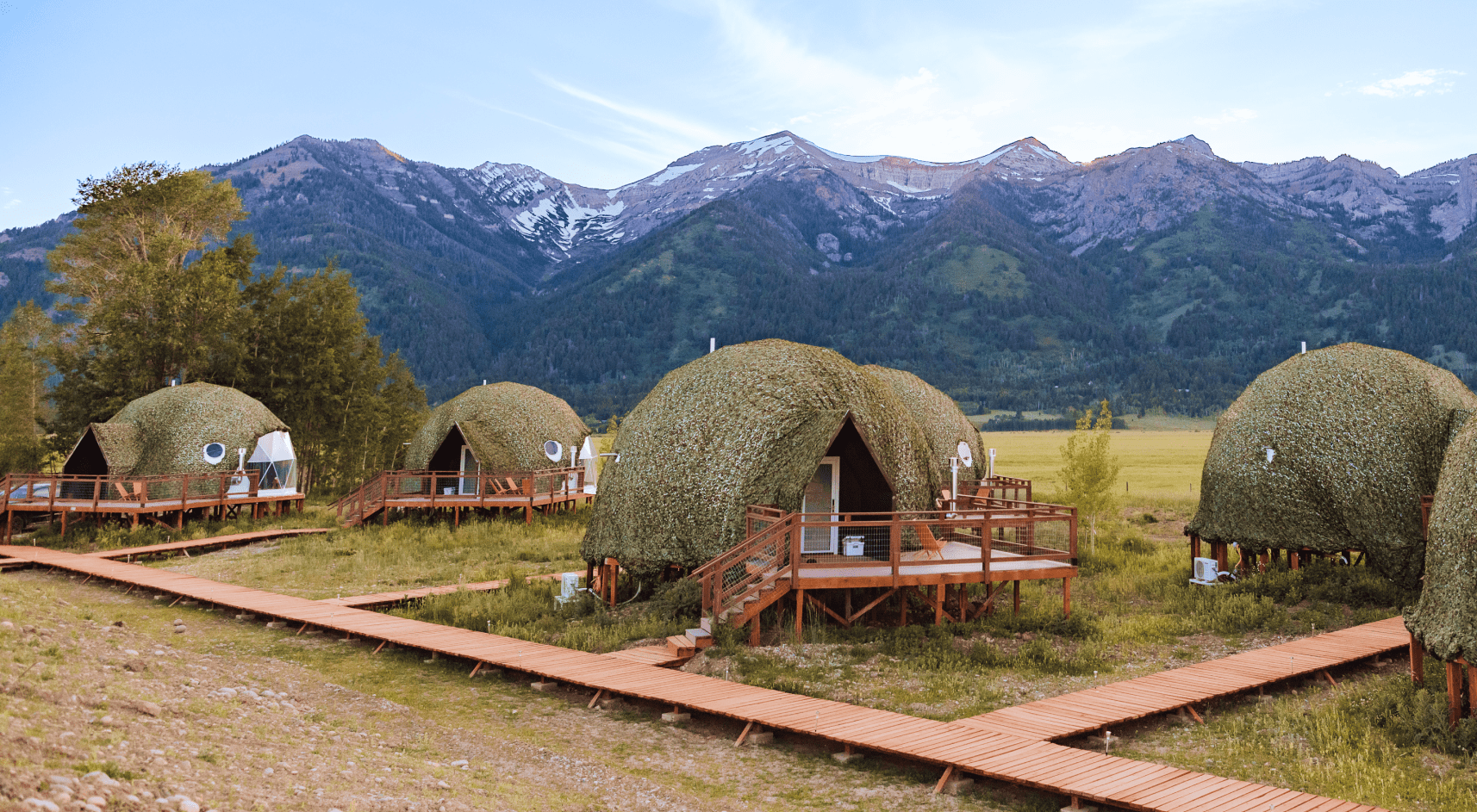 Geodesic domes in front of Grand Teton Mountains in the winter.