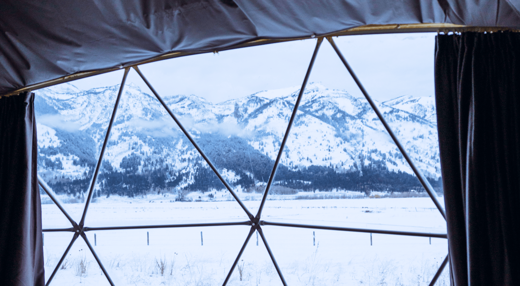 View of Grand Teton range from inside geodesic dome.