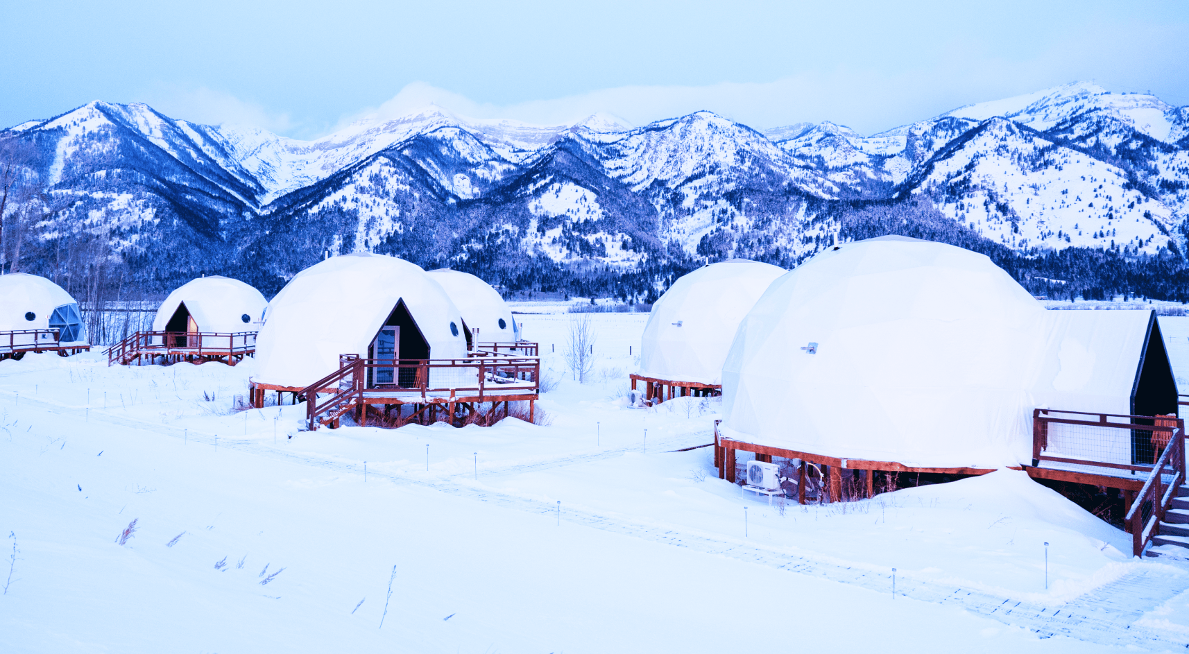Geodesic dome in front of Teton Mountains.