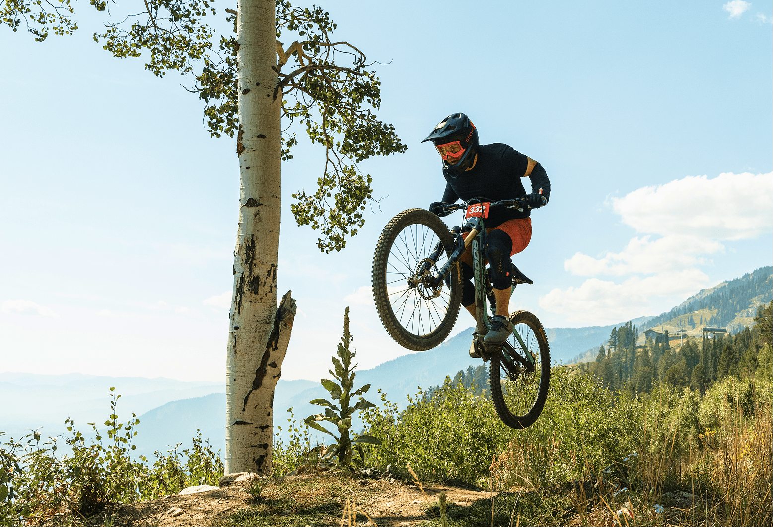 Mountain biking on a trail in the summer time