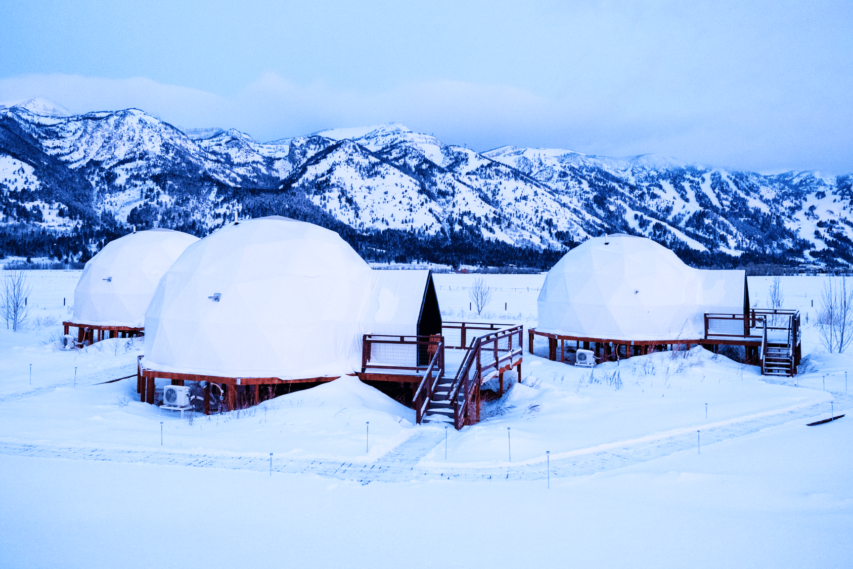 Tammah Jackson Hole sign in front of Grand Teton Mountain range.