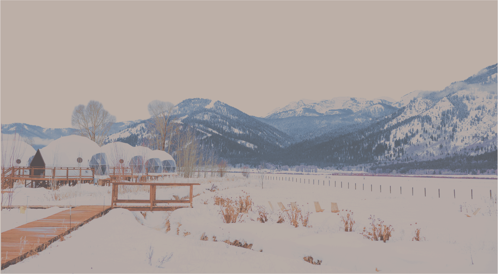 Geodesic domes in front of Tetons with sky cut out