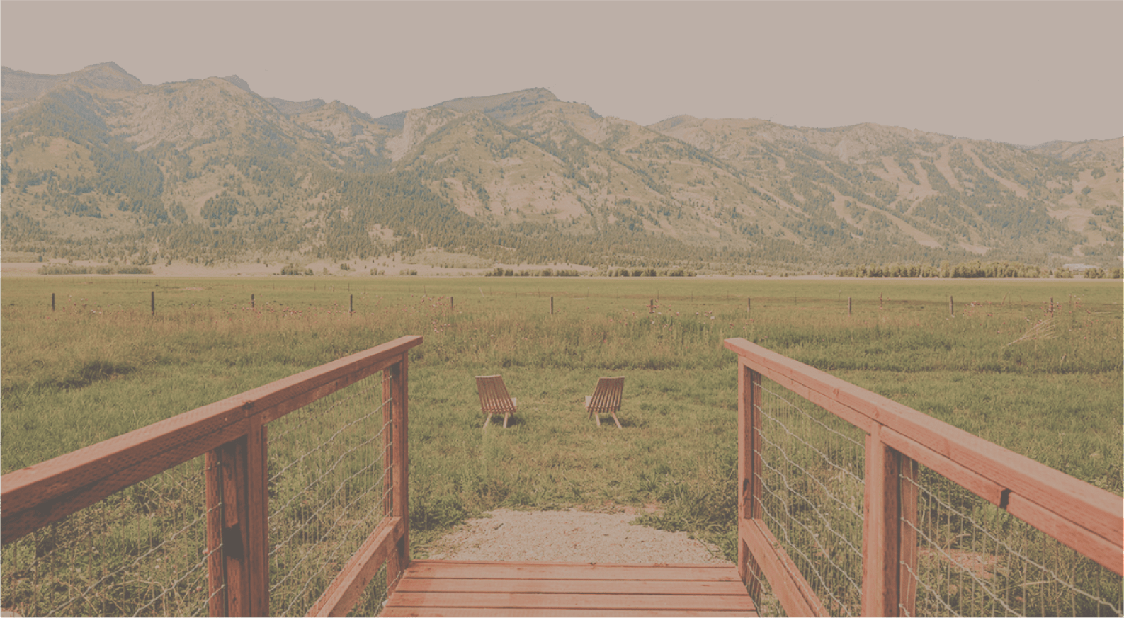 Geodesic domes in front of Tetons with sky cut out