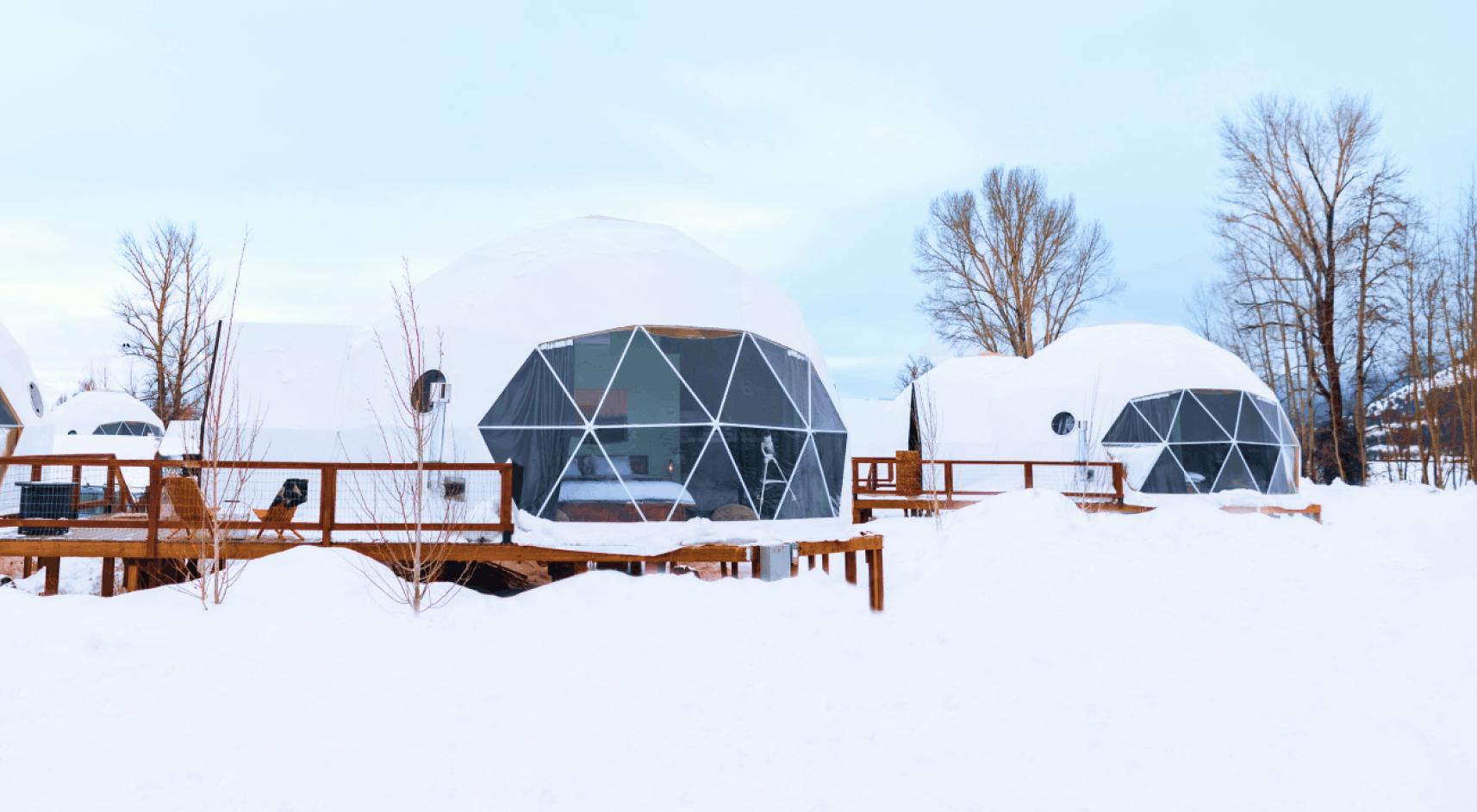 Tammah Jackson Hole sign in front of Grand Teton Mountain range.