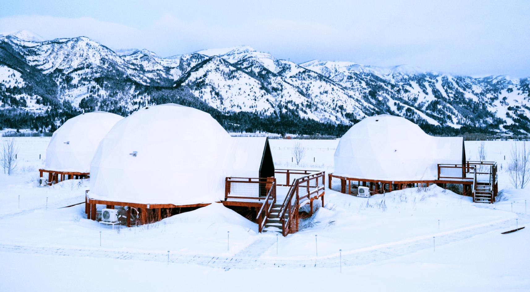 Geodesic dome in front of Teton Mountains.