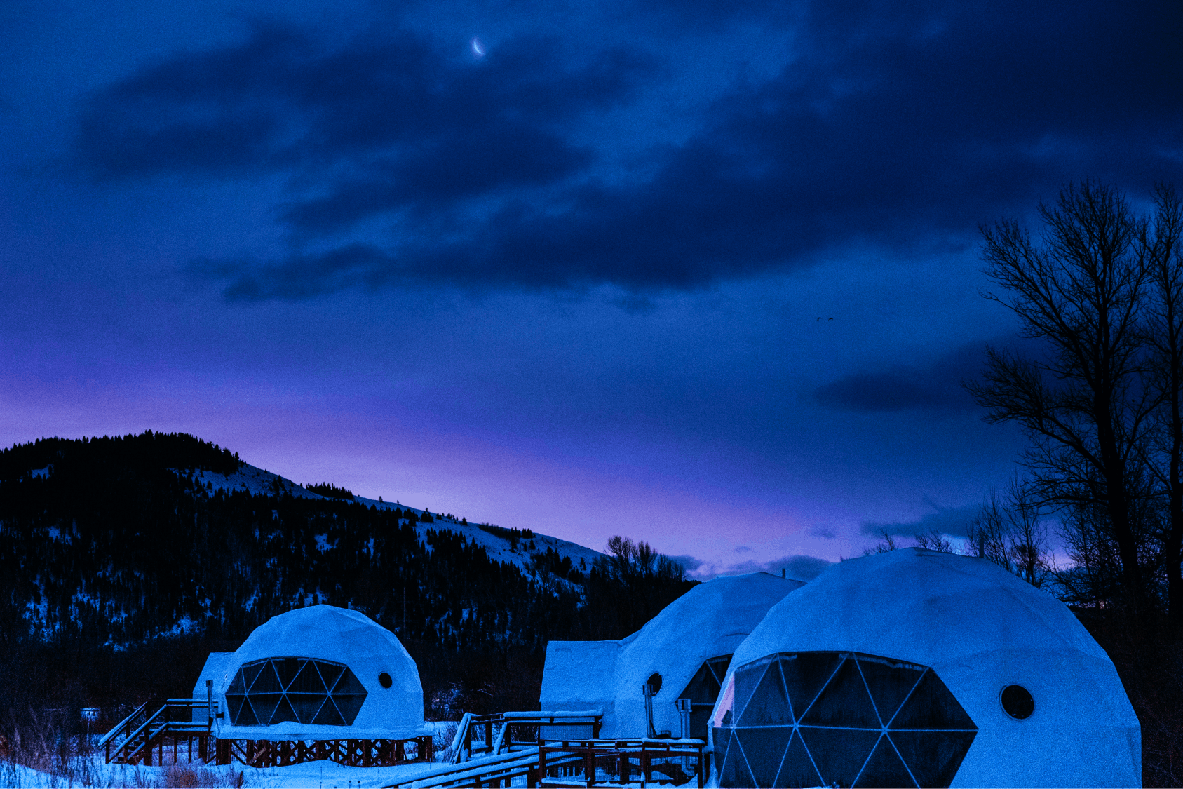 Decorative shot of bed with wide brimmed hat placed on top
