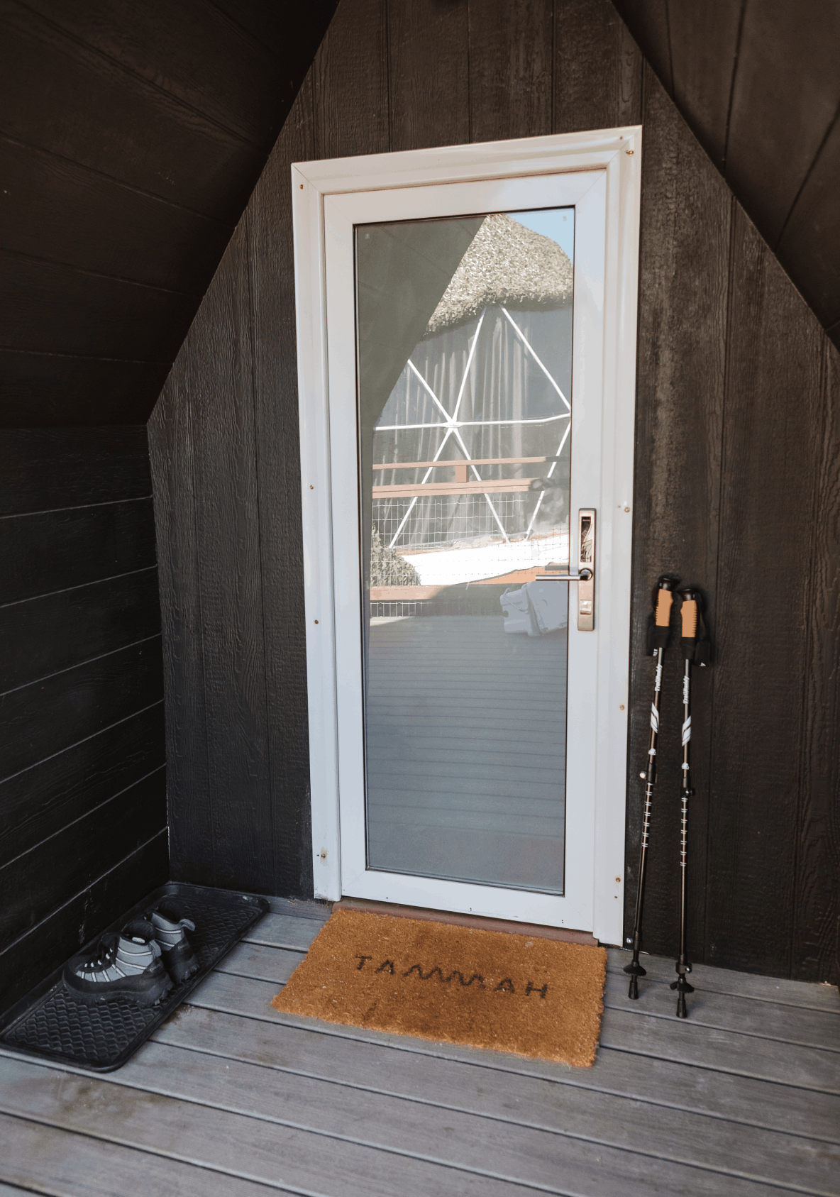 Decorative shot of bed with wide brimmed hat placed on top