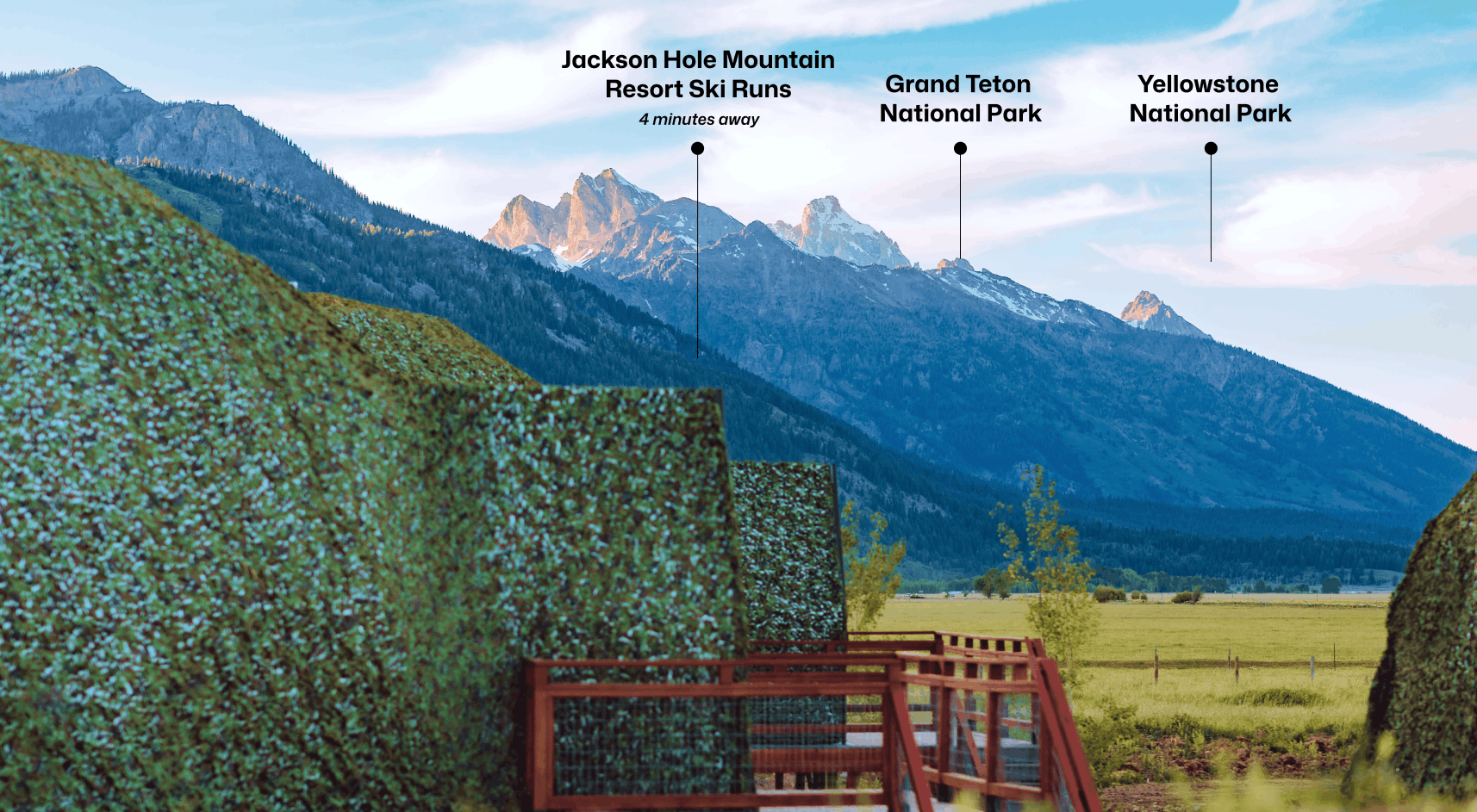 Geodesic dome in front of stream and Teton Mountains with pins pointing out JHMR, Grand Teton National Park, and Yellow Stone National Park.