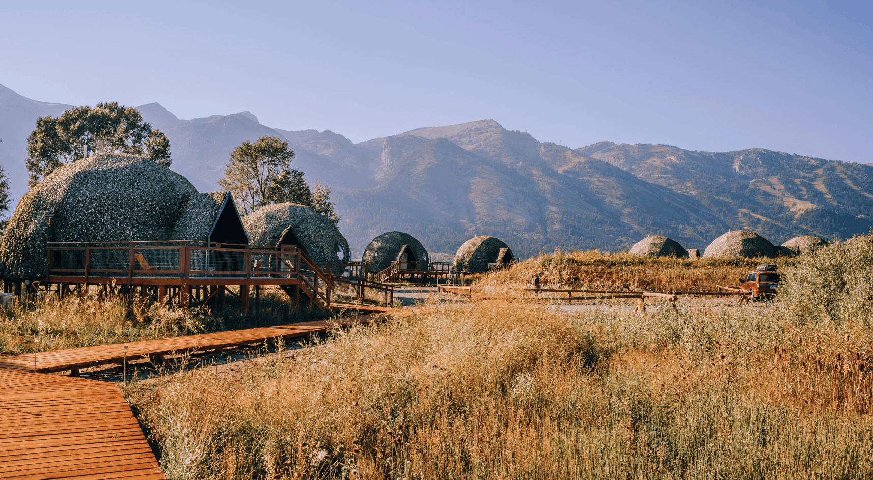 Geodesic domes in front of Grand Teton Mountains in the winter.