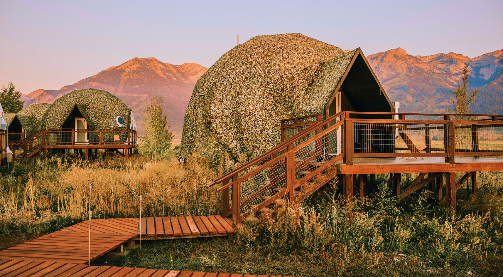Geodesic domes in front of Grand Teton Mountains in the winter.
