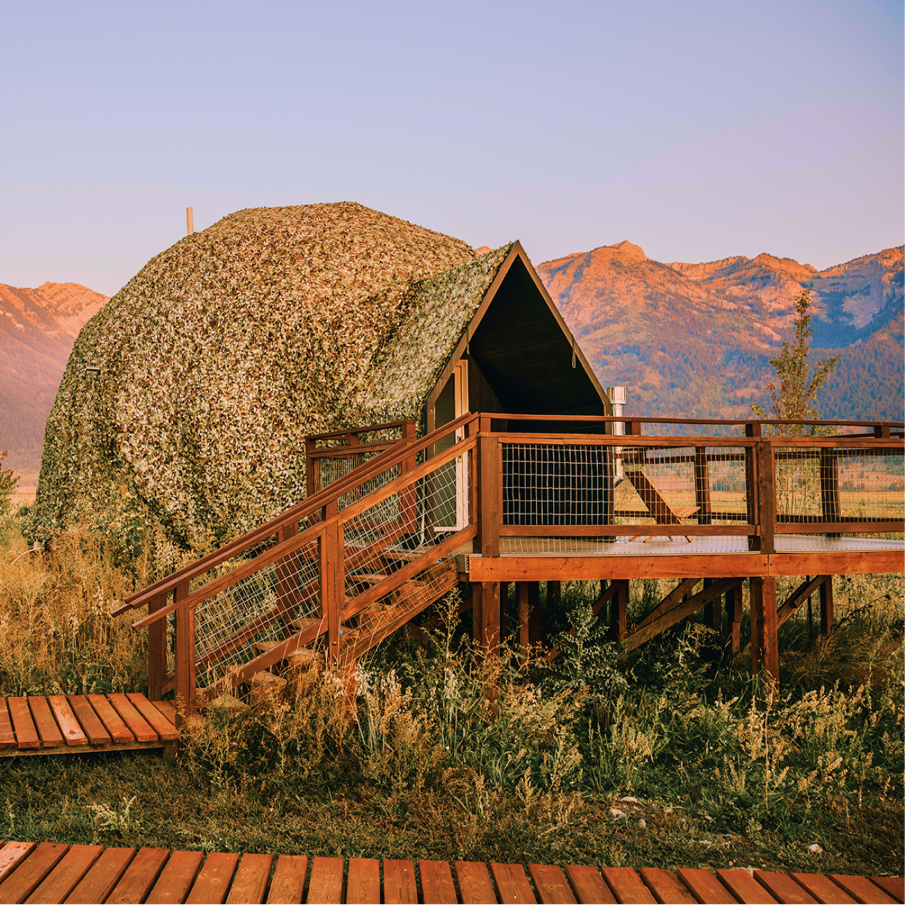 Geodesic domes in front of Grand Teton Mountains in the winter.