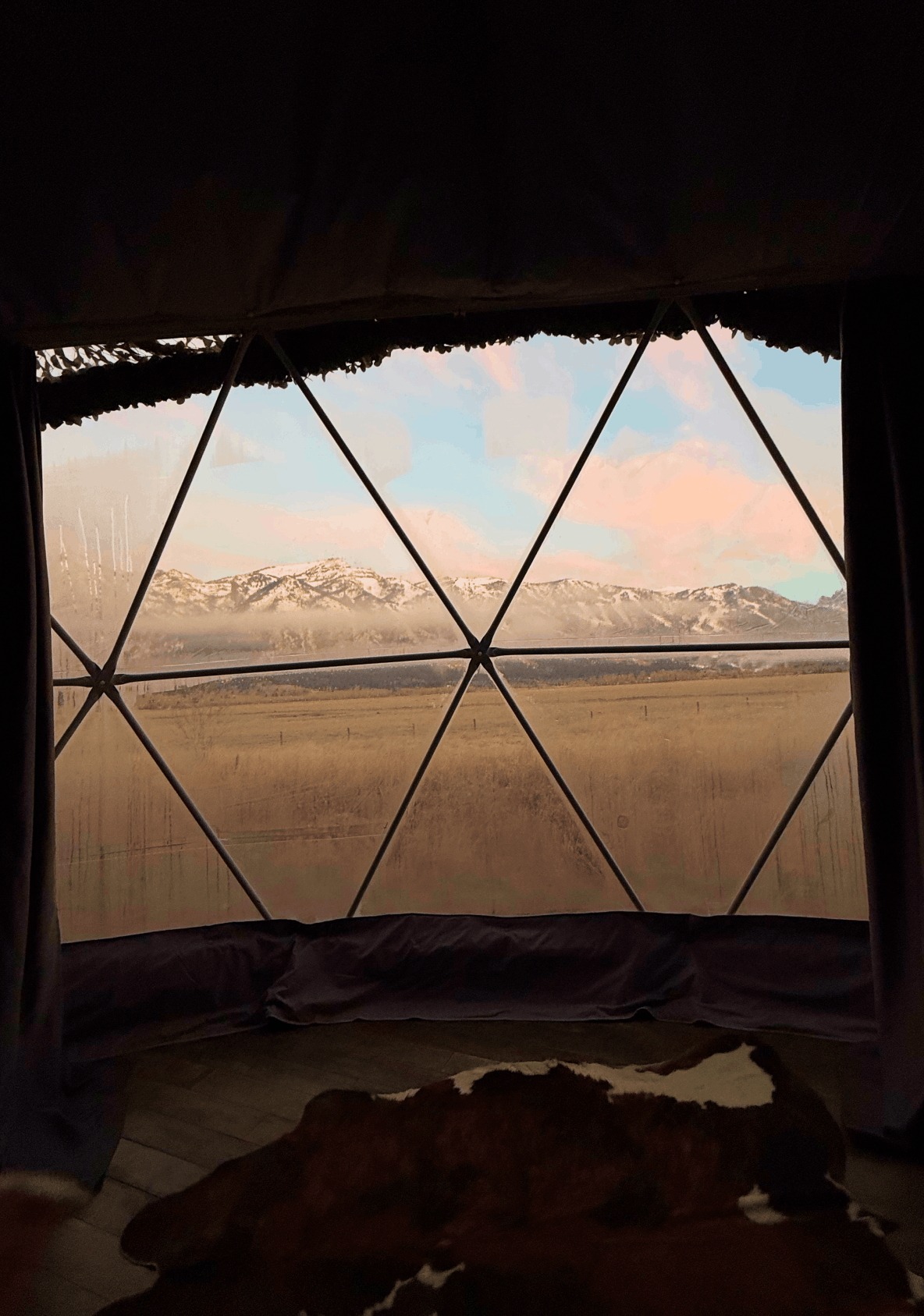 Sink and mirror in bathroom of geodesic dome