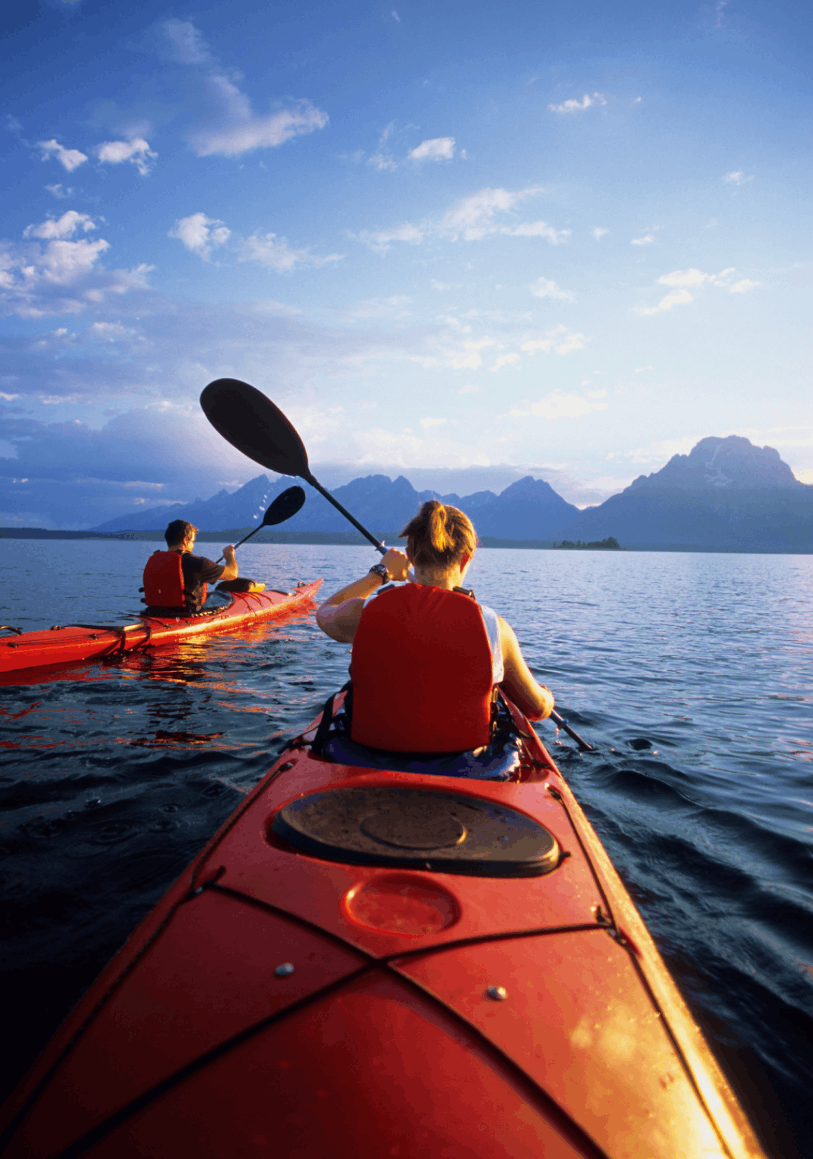 Kayaking in Snake River in front of the Teton Mountains