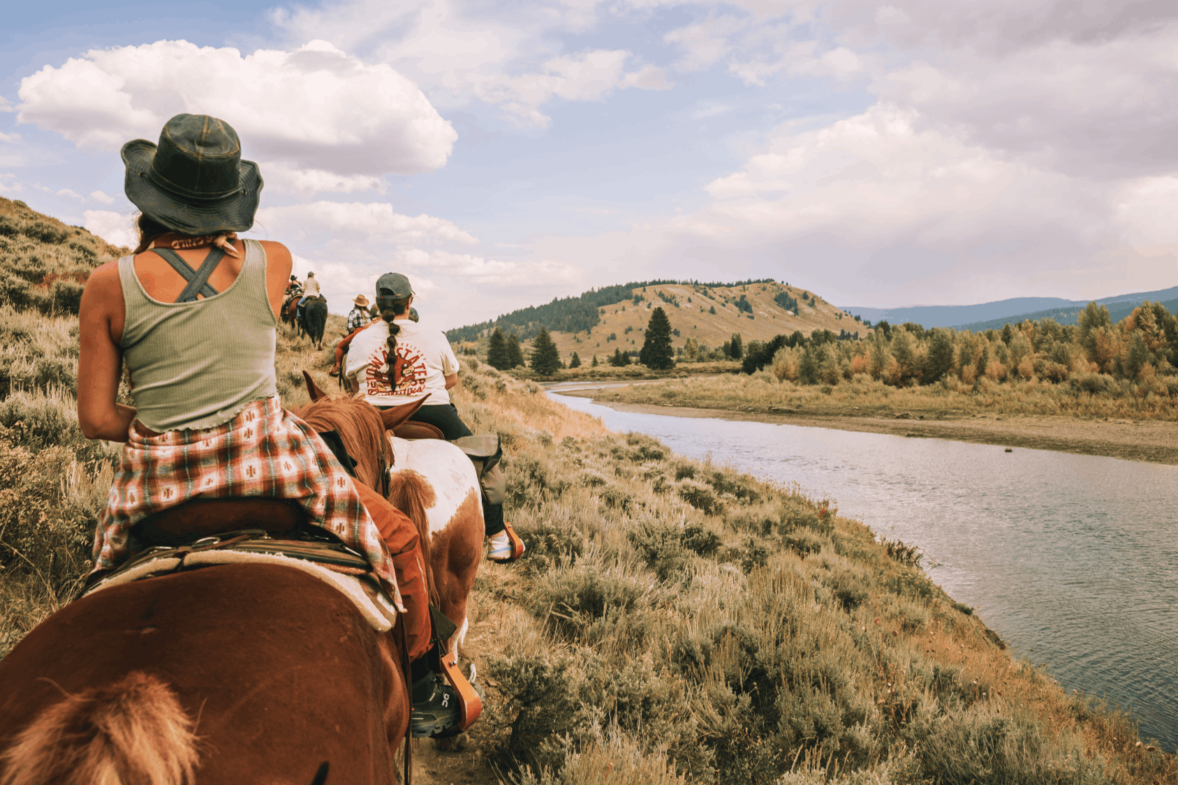 Stylish girl horseback riding