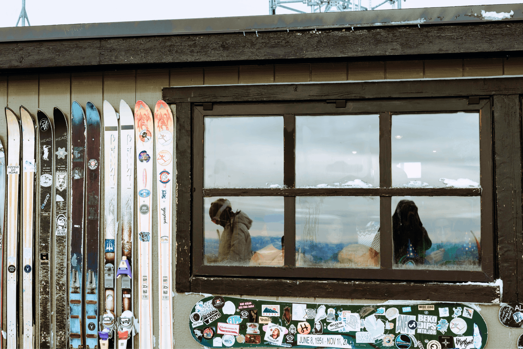 Geodesic dome in front of stream and Teton Mountains with pins pointing out JHMR, Grand Teton National Park, and Yellow Stone National Park.