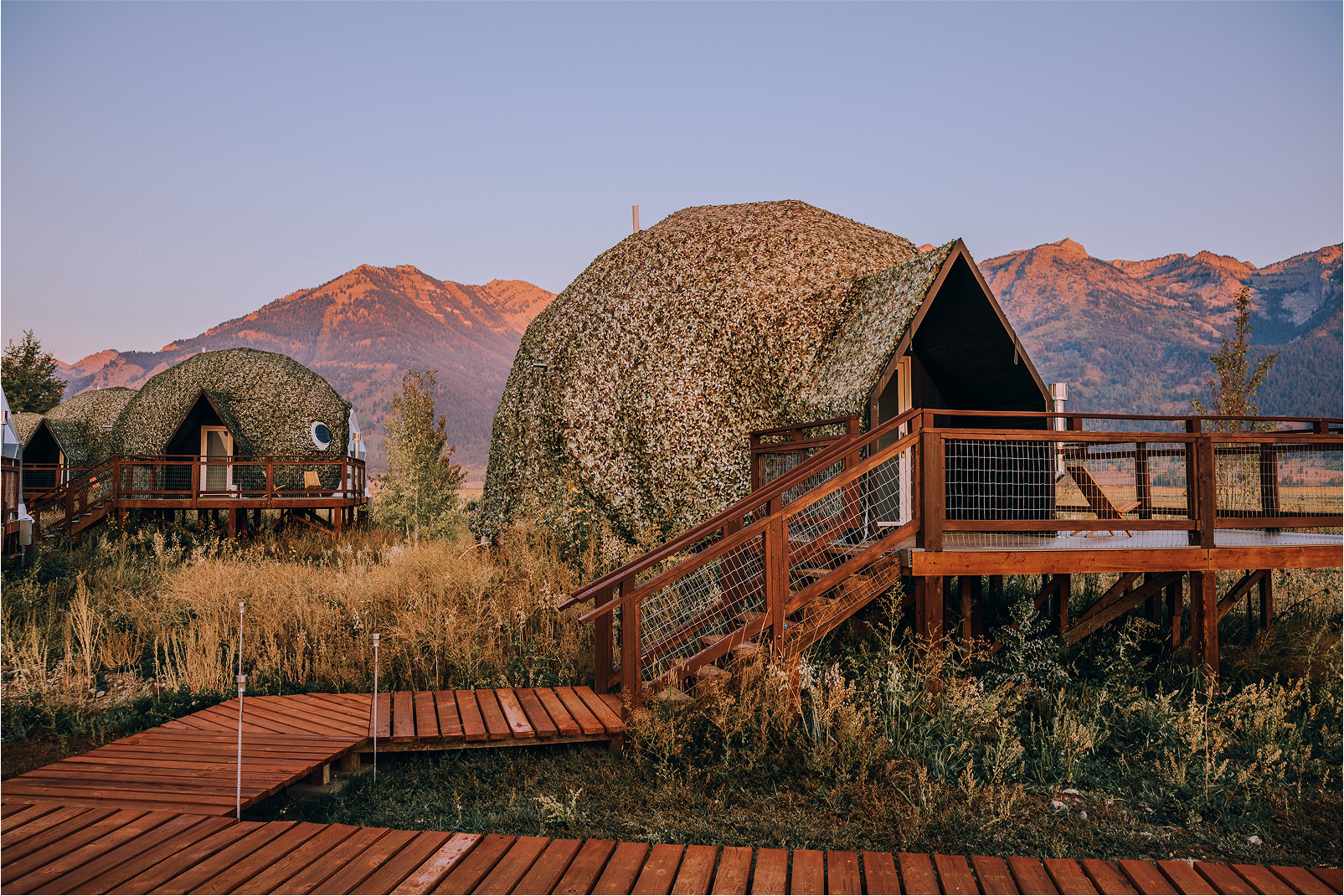 Geodesic domes in front of Grand Teton Mountains in the winter.