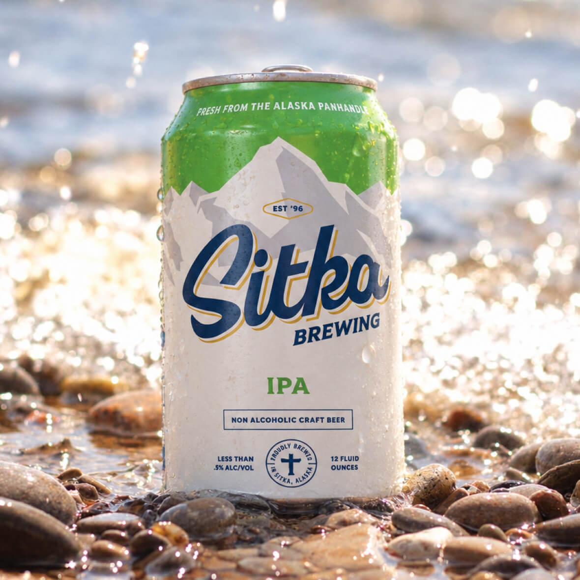 Sitka Brewing IPA can on a rocky shoreline