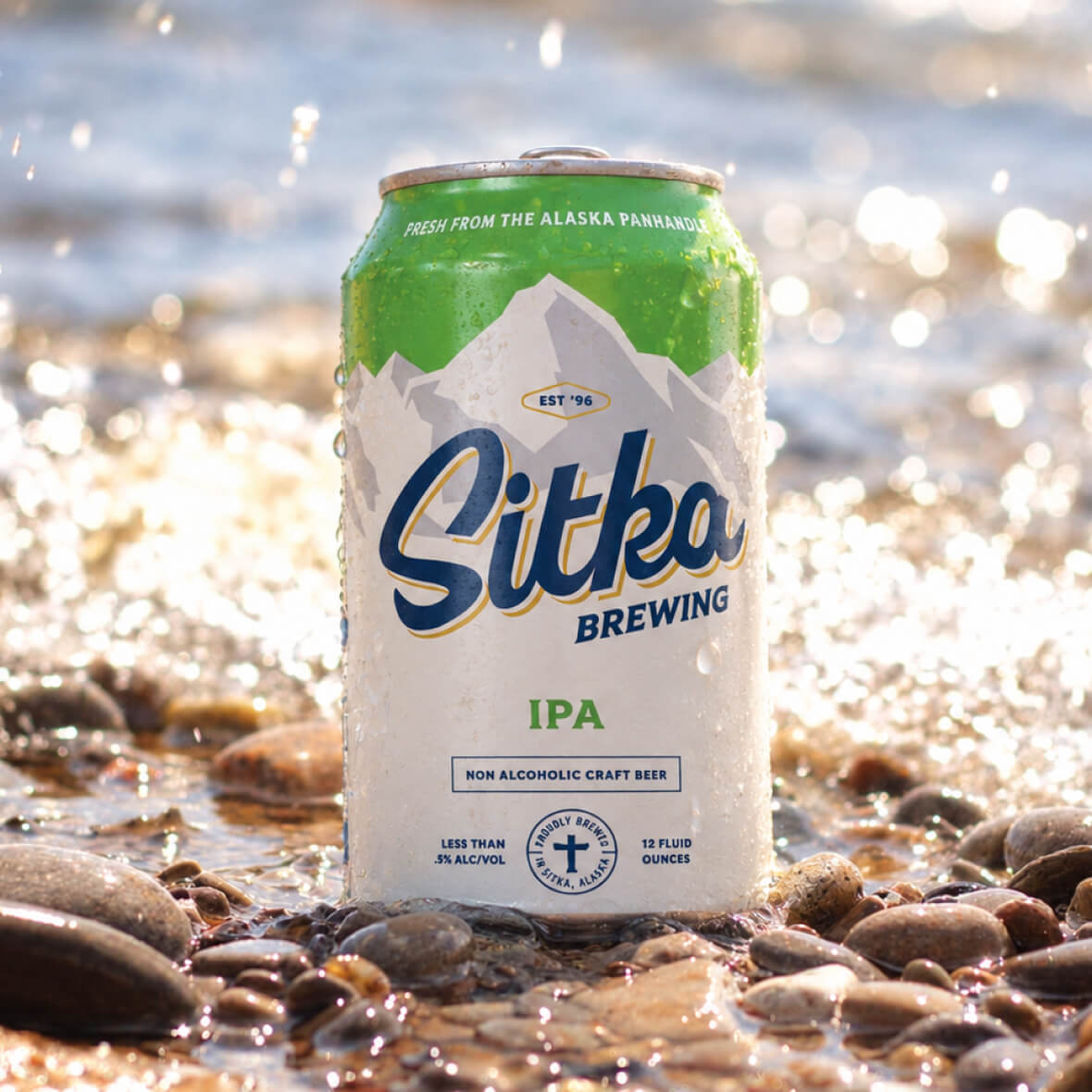 Sitka IPA can on a rocky shoreline