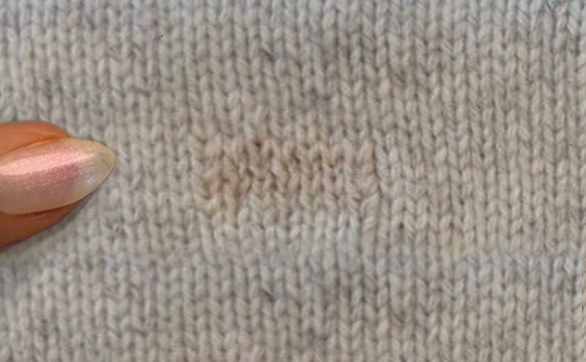 FXRY's reknit sample on a grey knit
